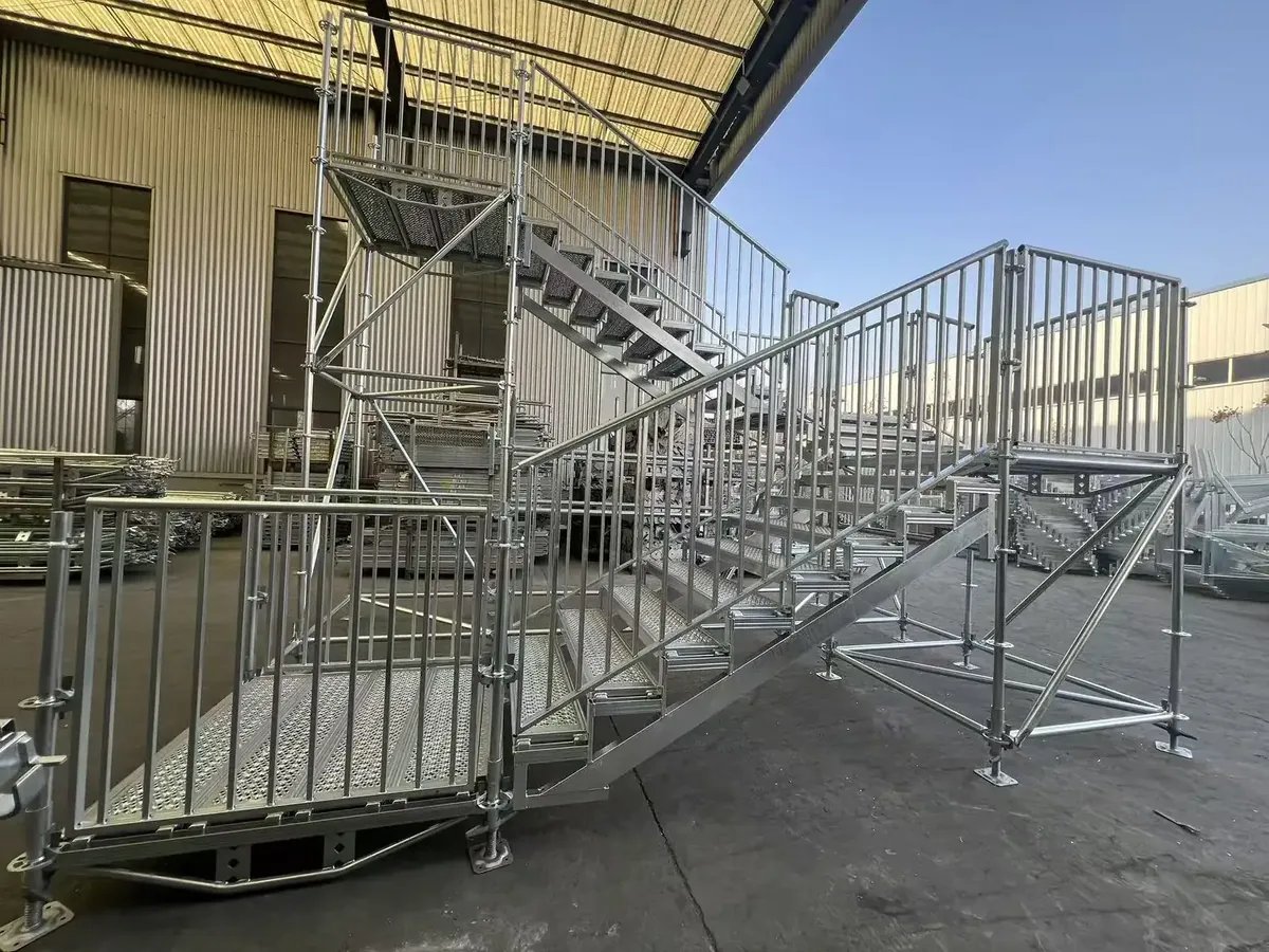 Ringlock scaffolding stair tower with guardrails and steel planks