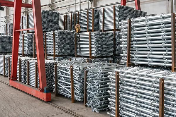 Galvanized ringlock scaffolding standards stored in racks