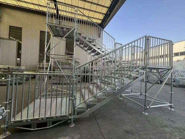 Ringlock scaffolding stair tower with guardrails and steel platforms