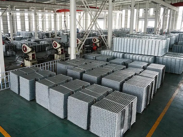 Stacks of galvanized ringlock scaffolding steel planks in the LuckyScaffolding factory