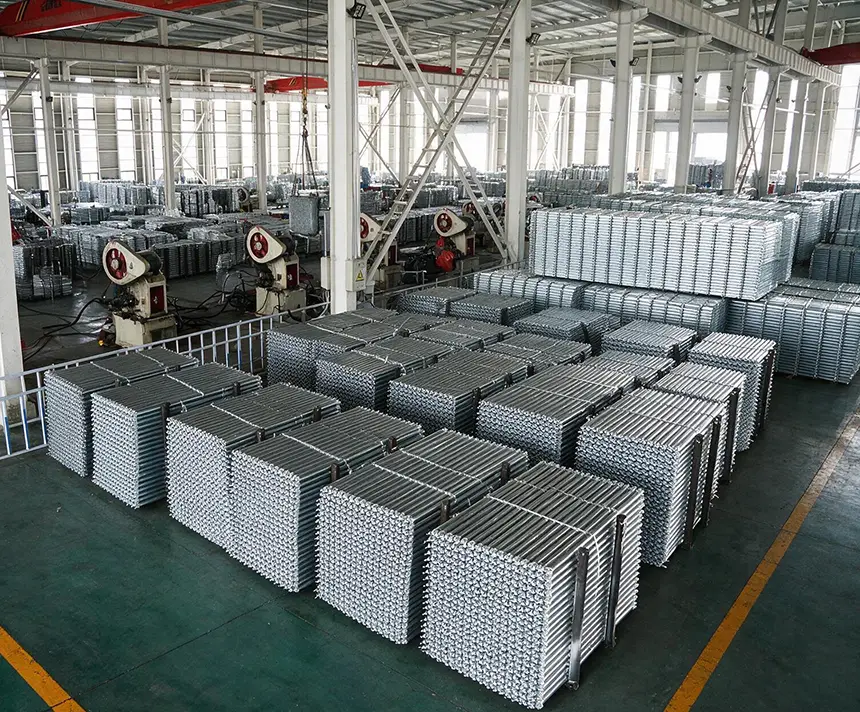 Stacks of galvanized ringlock scaffolding steel planks in the LuckyScaffolding factory